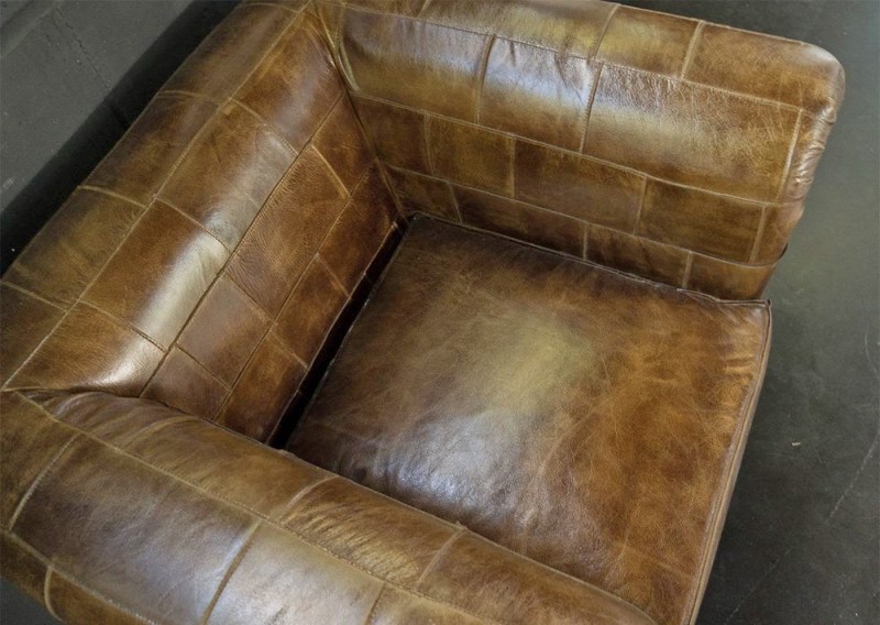 Fauteuil chesterfield en cuir patchwork